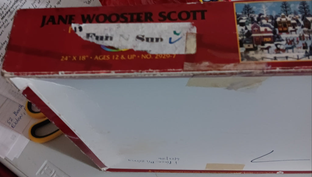 box lid featuring a red top band with the text 'JANE WOOSTER SCOTT' puzzle name is 'Pursuits of the Past'