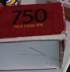 A red puzzle box  showing the back and one corner. 