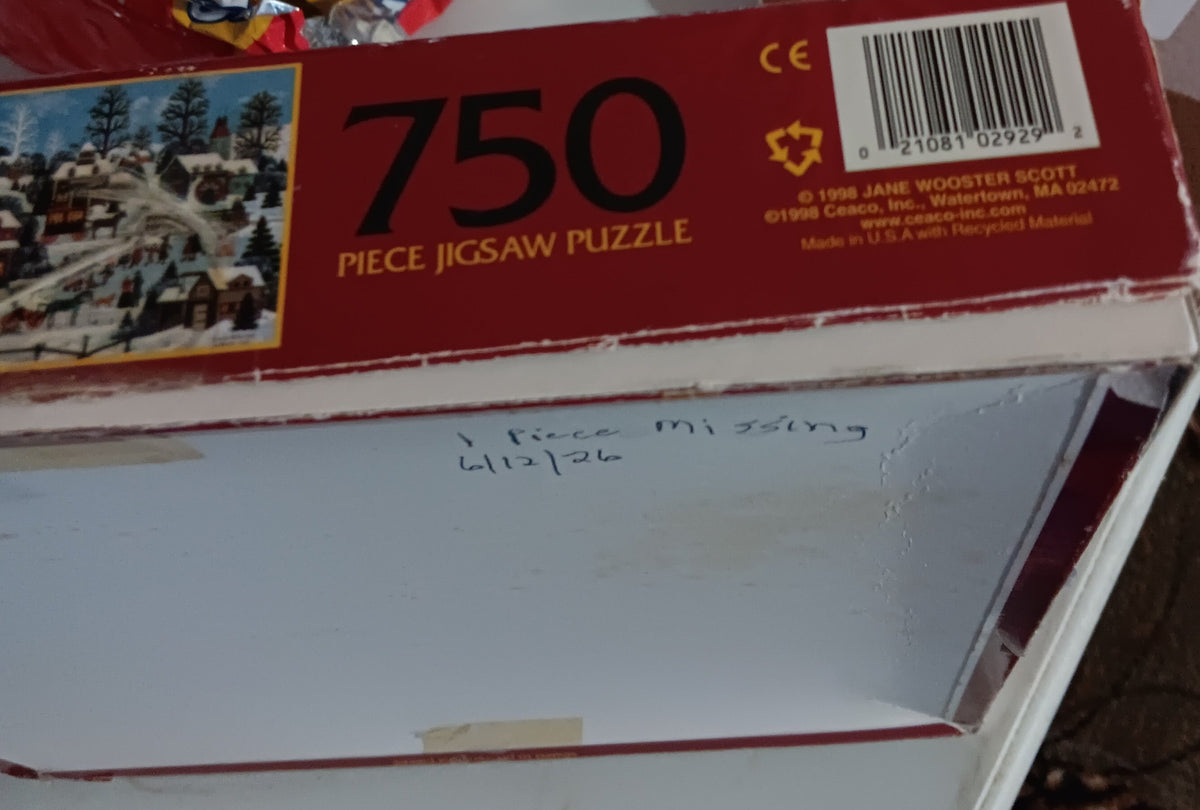 A red 750-piece jigsaw puzzle box of Pursuits of the Past by Jane Wooster Scott