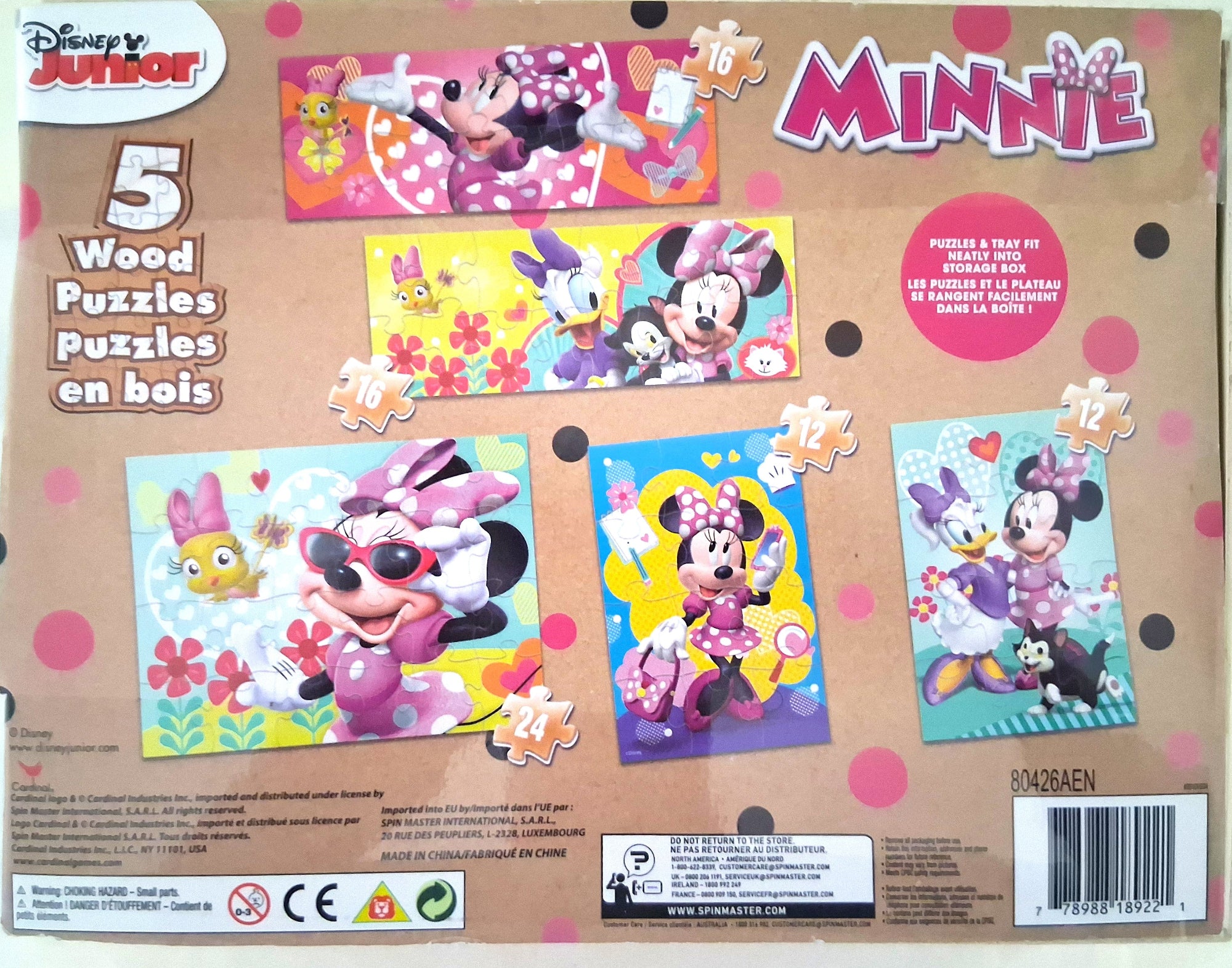Front of a Disney Junior Minnie Wood Puzzles in box, showing five colorful puzzle panels with Minnie Mouse and Daisy Duck illustrations on a tan background with pink polka dots.