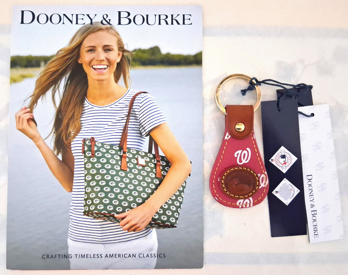 A Dooney & Bourke , a red leather keychain with a red and white Washington Nationals design, and branded hang tags.